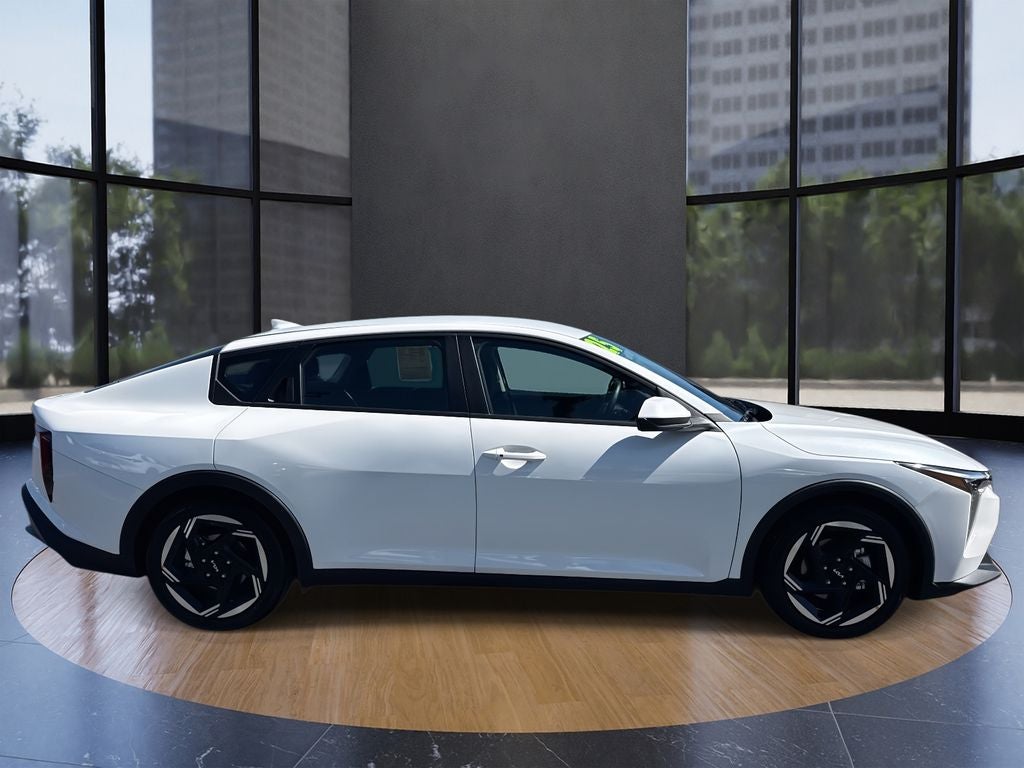2025 Kia K4 EX in Snow White Pearl — front three-quarter view